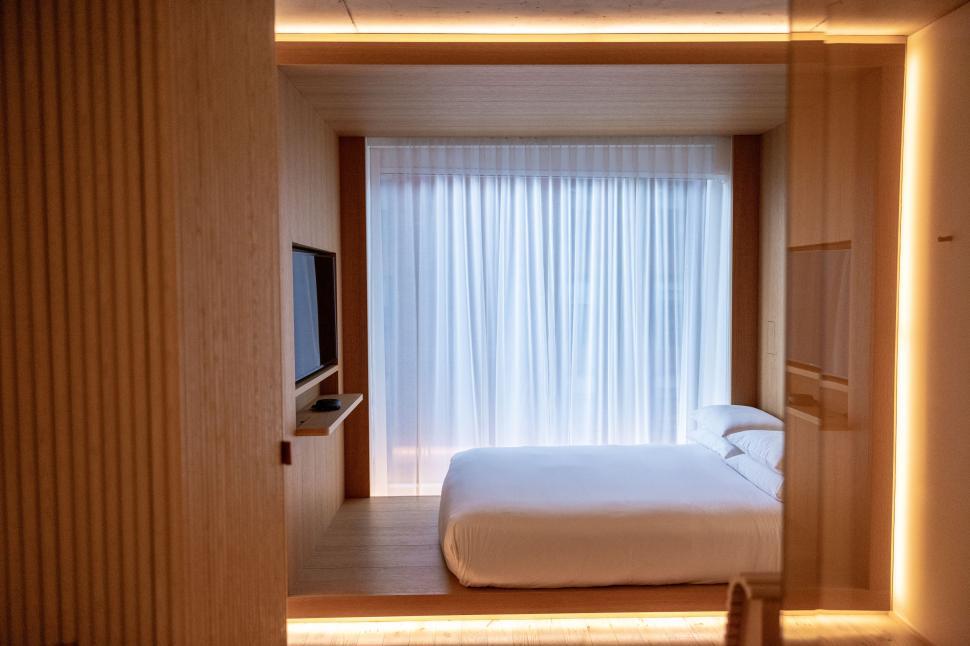 Free Image of Modern minimalist bedroom with natural light panels. 