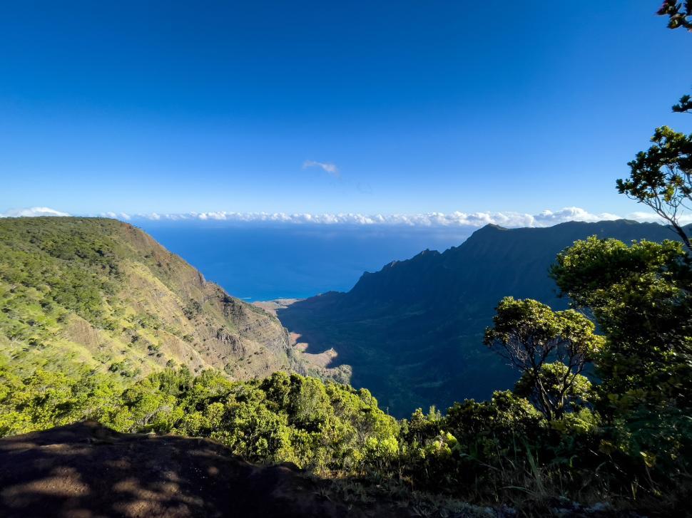 Free Image of Panoramic view of mountains converging into the ocean 