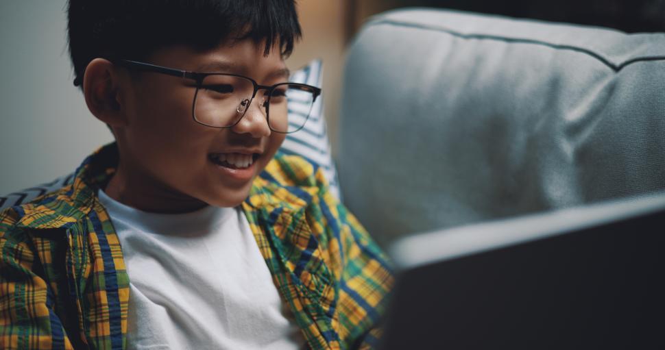 Free Image of Smart boy use laptop computer to learning online at home 