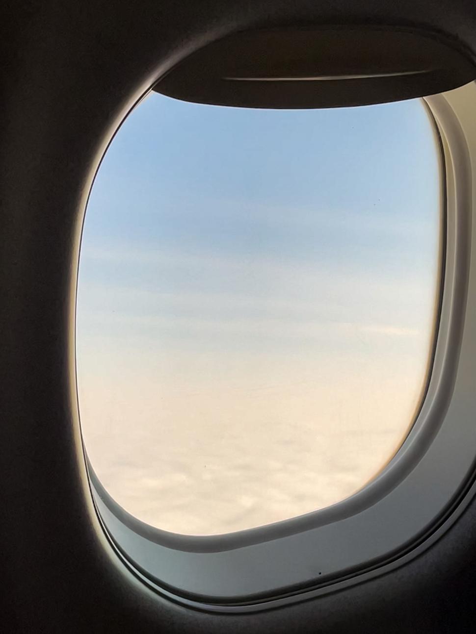 Free Image of View from an airplane window of sky and clouds outside 