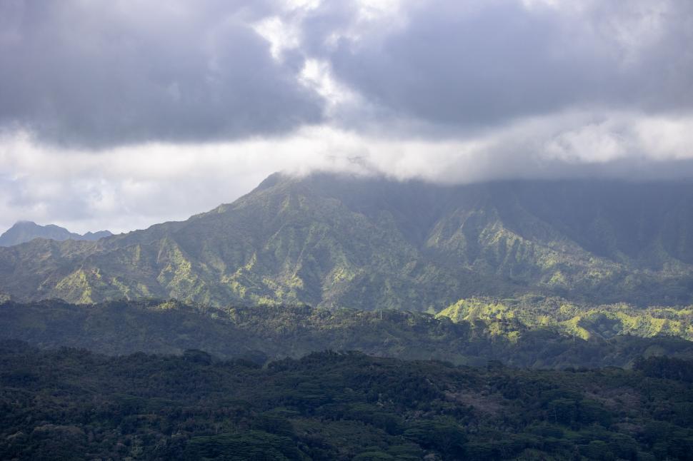 Free Image of Majestic mountain range under a cloudy dramatic sky 