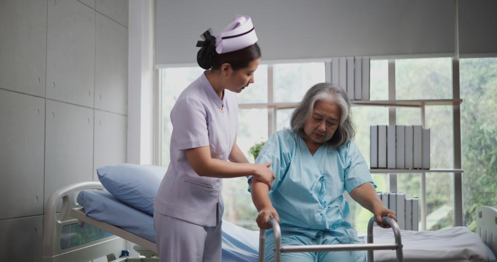 Free Image of Portrait of Young nurse caring for an elderly woman to walk with a walker at the hospital. Healthcare, Retirement, Volunteer, Caregiver and Lifestyle concept 