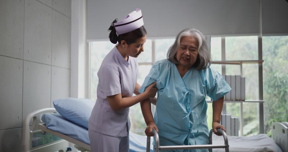 Free Image of Portrait of Young nurse caring for an elderly woman to walk with a walker at the hospital. Healthcare, Retirement, Volunteer, Caregiver and Lifestyle concept 