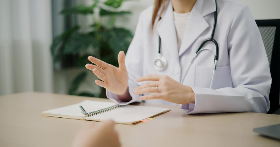Free Image of Selective focus hands of Asian doctor explains health problem of young female patient in clinic office, Health and medicine consultant, conversation about healthcare 