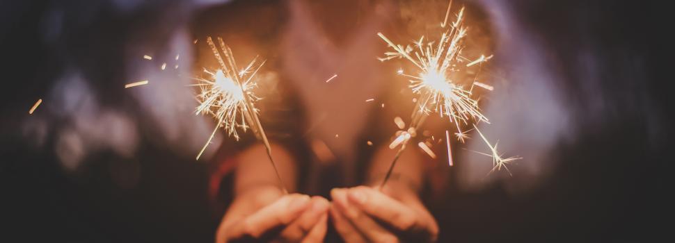 Free Image of Female hand enjoy with burning Sparkler blast in new year party 