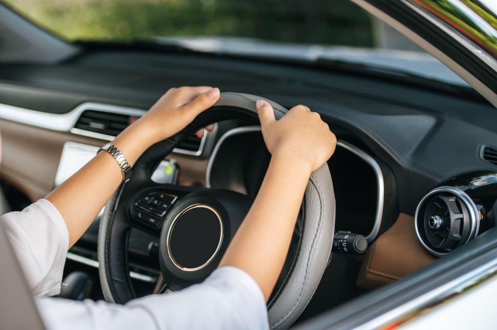 Free Image of man holding steering wheel in car 