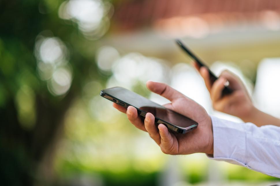 Free Image of male hand holding a smartphone 