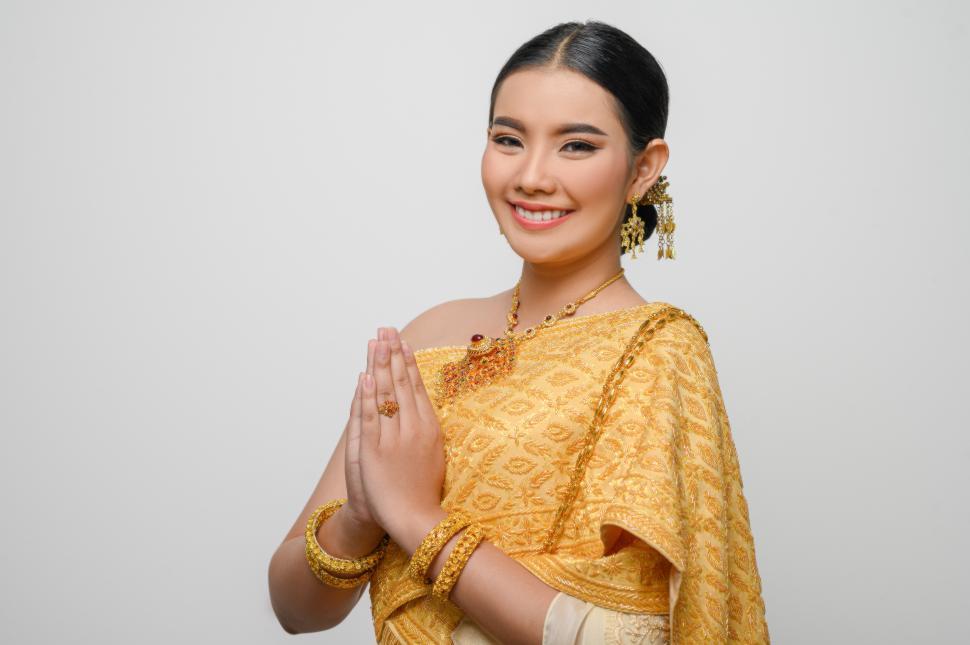 Free Image of Beautiful Asian woman in traditional Thai dress costume white background 
