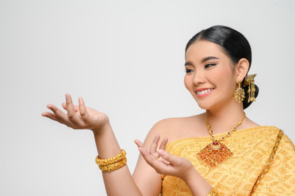 Free Image of Beautiful Asian woman in traditional Thai dress costume white background 