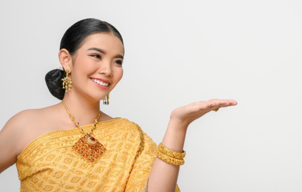Free Image of Beautiful Asian woman in traditional Thai dress costume white background 