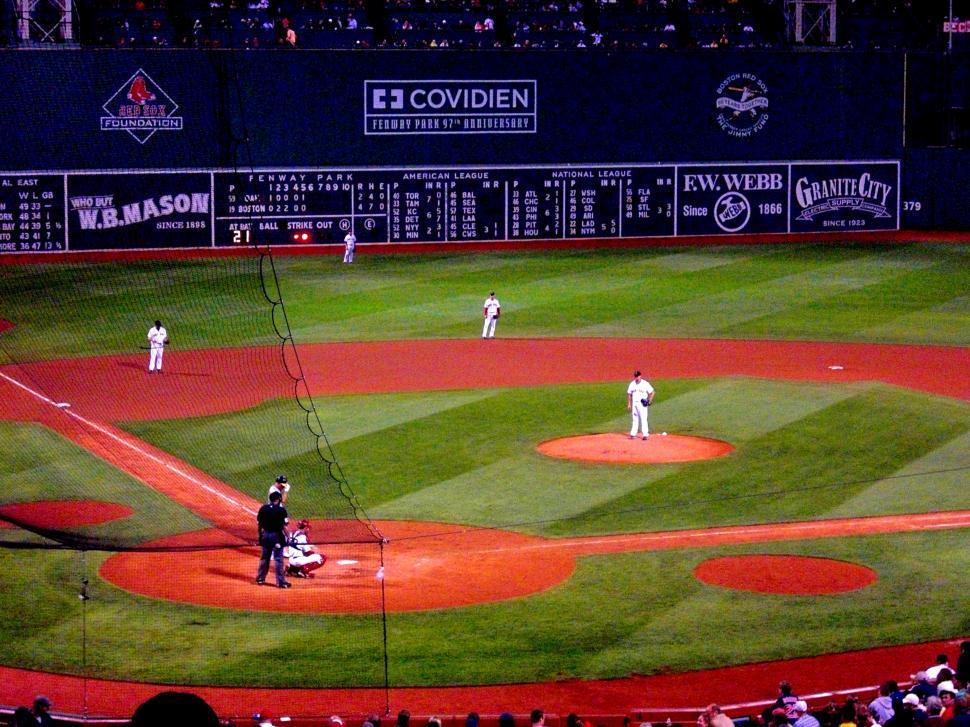 Free Image of Group of Baseball Players Standing on Top of Field 