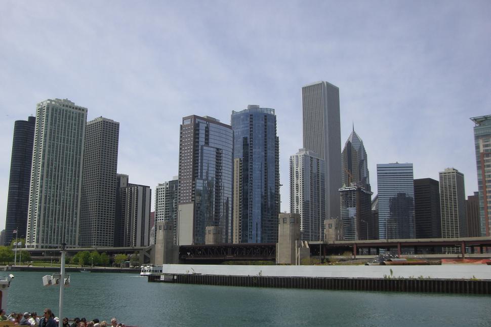 Free Image of Cityscape Across Vast Water Body 