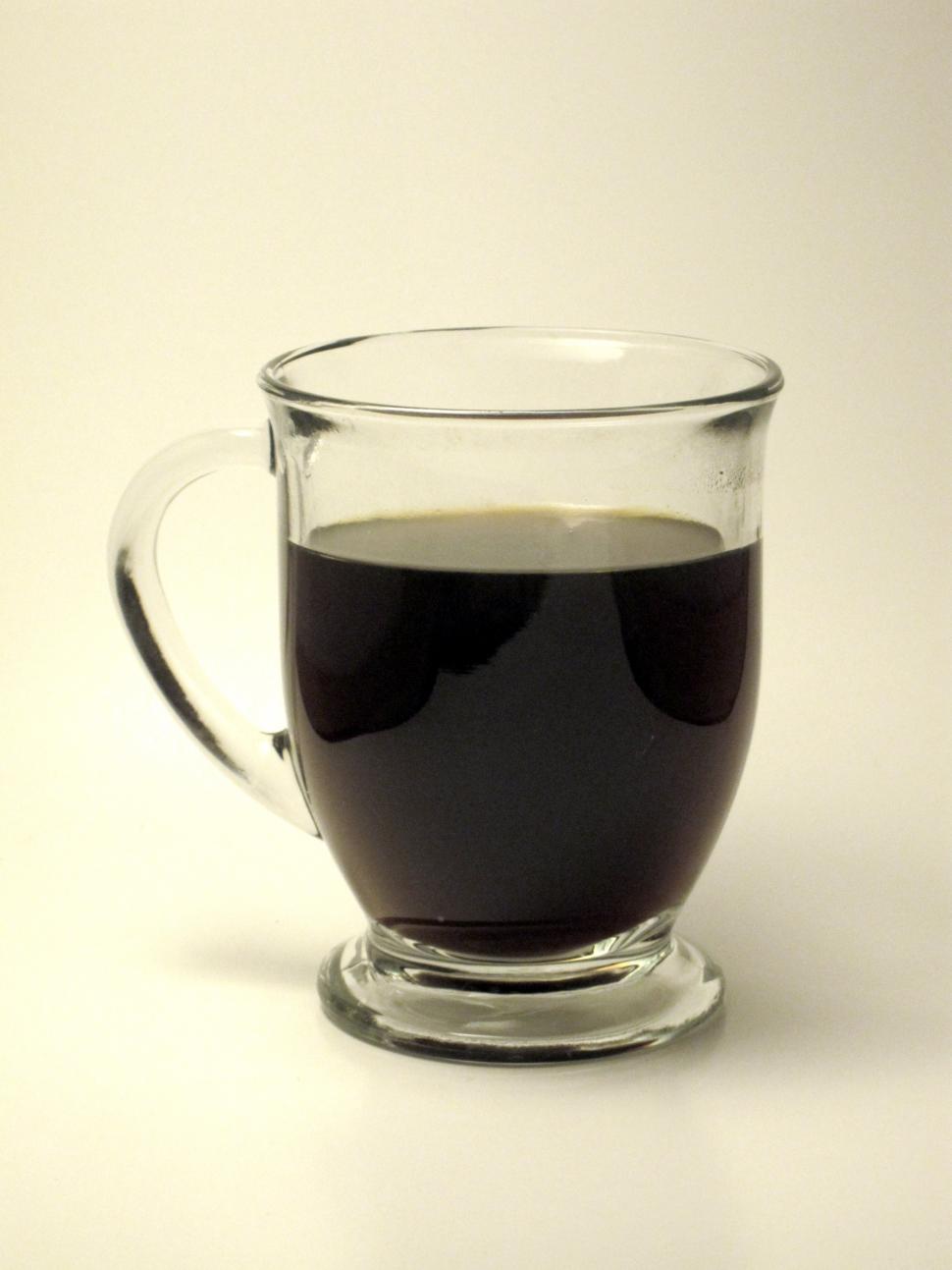Free Image of Glass Cup Filled With Liquid on Table 