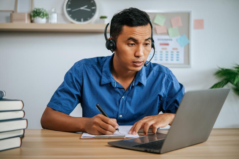 Free Image of man with headphones working in office 