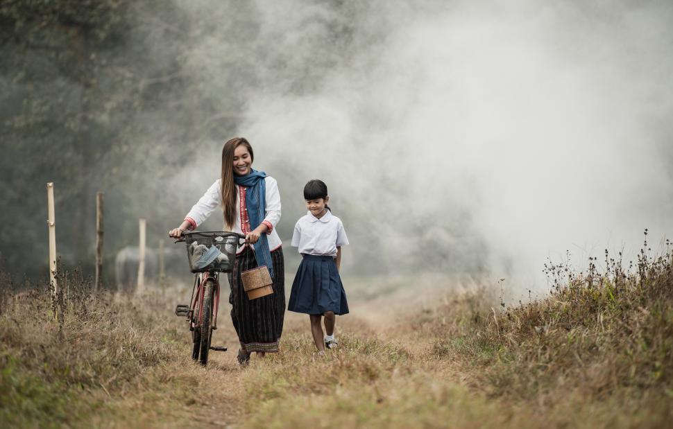 Free Image of Grandmother and granddaughter walking in the fields 