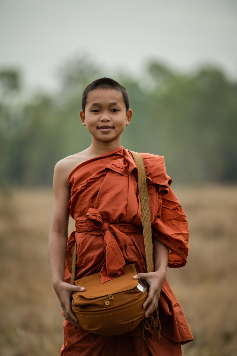 Free Image of Novice monks walking in the meadow 
