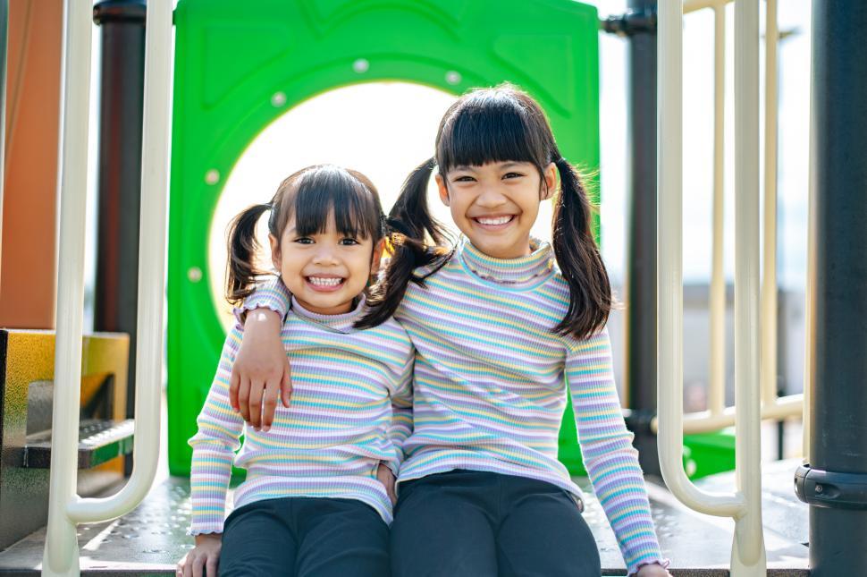 Free Image of two girls playing in the playground. 