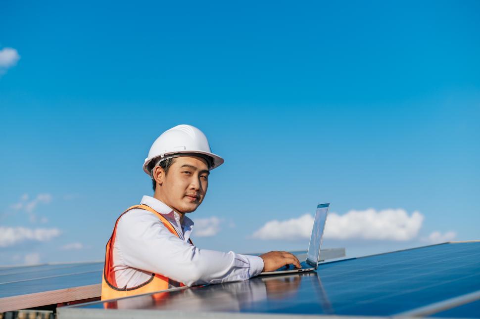 Free Image of Young Asian technician man checking operation photovoltaic solar panel 