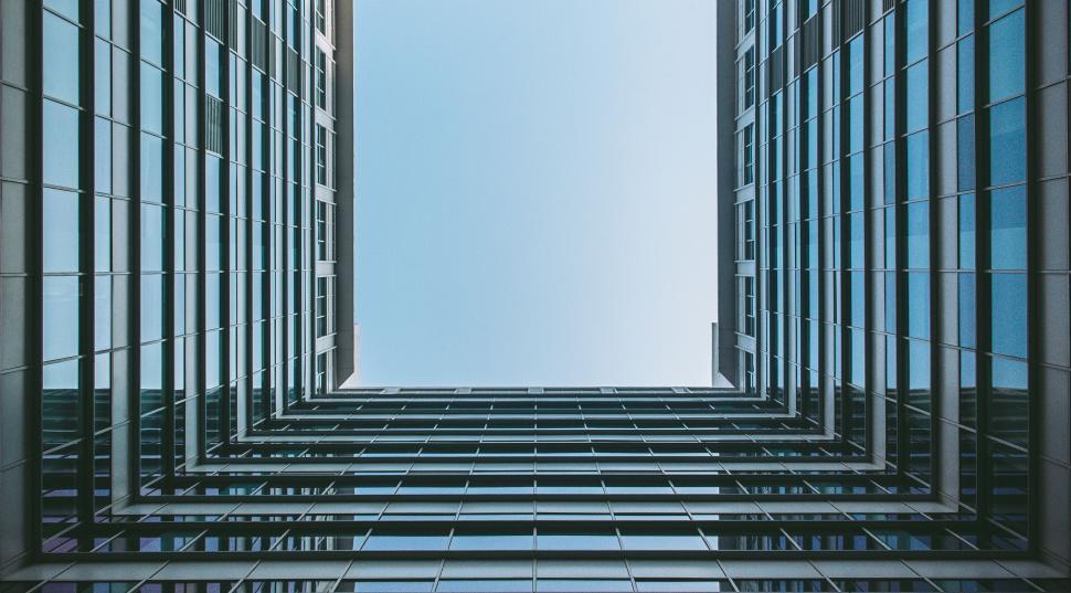 Free Image of Symmetrical skyscrapers with a blue sky background 