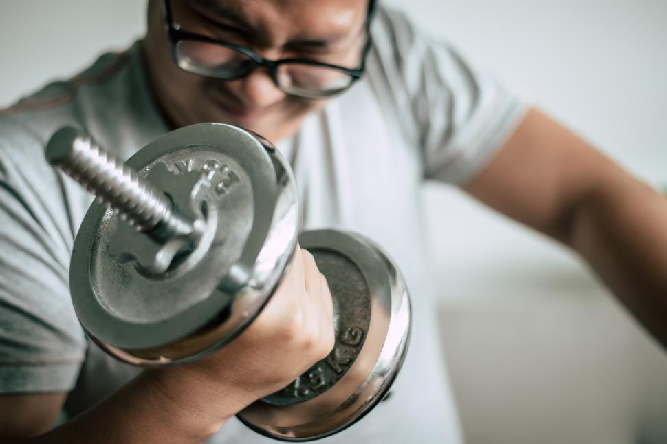Free Image of Funny fat man workout with dummbell 