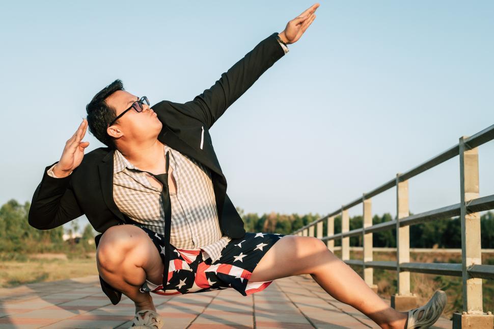 Free Image of Young funny businessman man in crazy and funny manner posture 