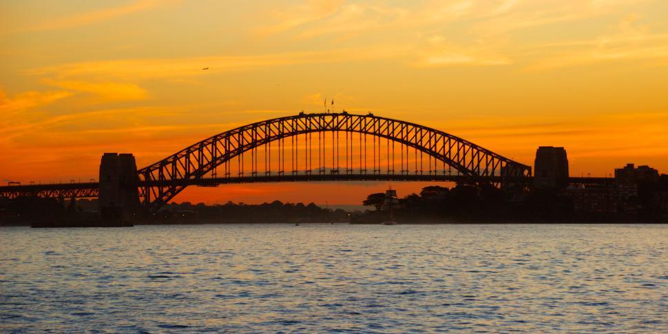 Free Image of Iconic bridge at sunset with vibrant colorful sky hues. 