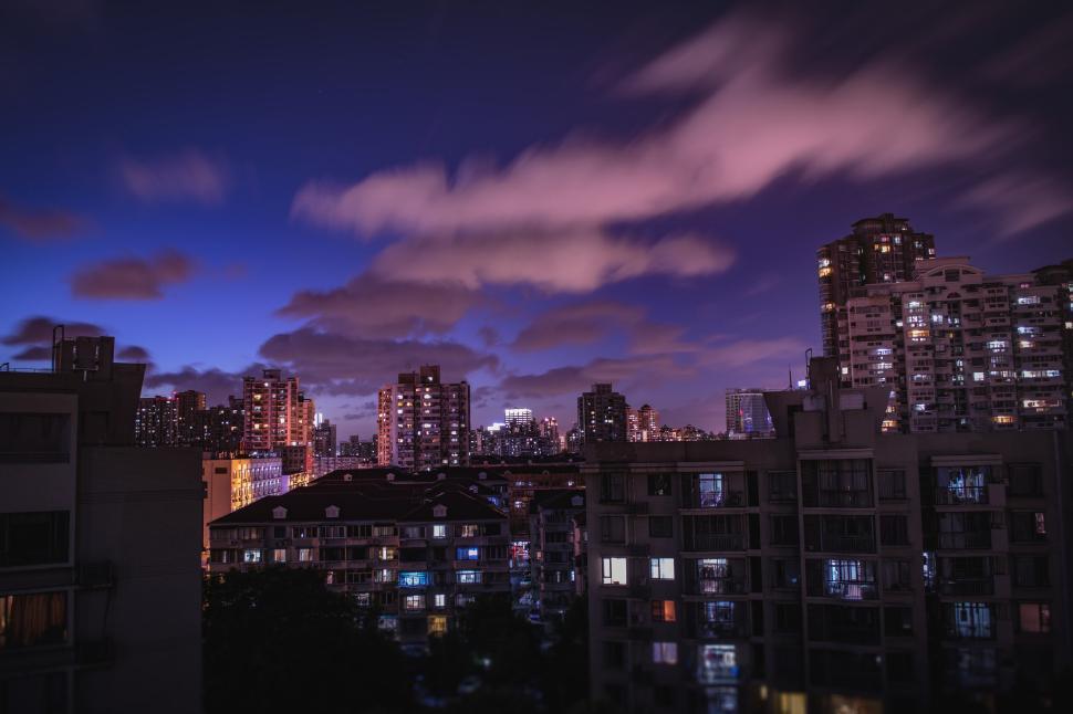 Free Image of Cityscape at twilight with lights and buildings visible. 
