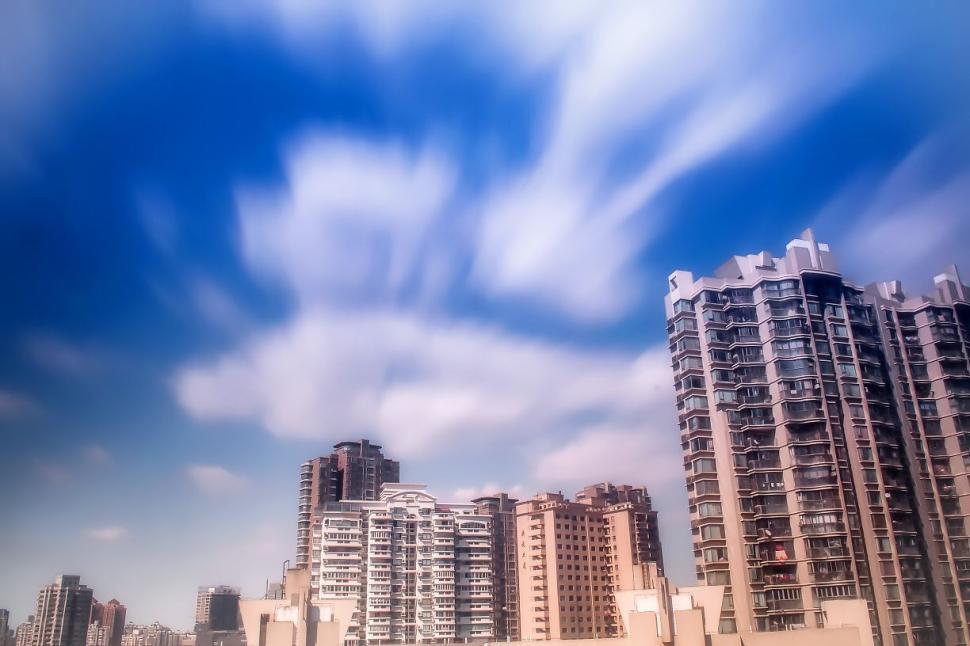 Free Image of Daytime cityscape with modern high-rise buildings and sky 
