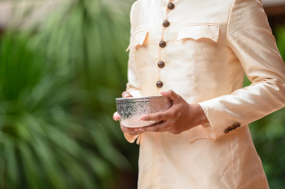 Free Image of Portrait handsome man in Songkran festival with water bowl 