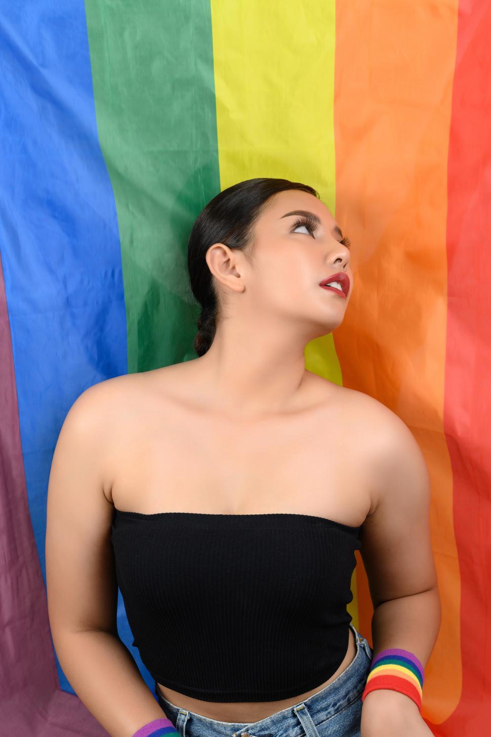 Free Image of Woman LGBTQ pose with rainbow pride flag 