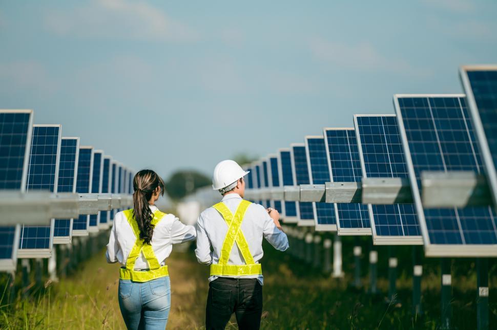 Free Image of Inspector Engineers walking operation in solar farm 