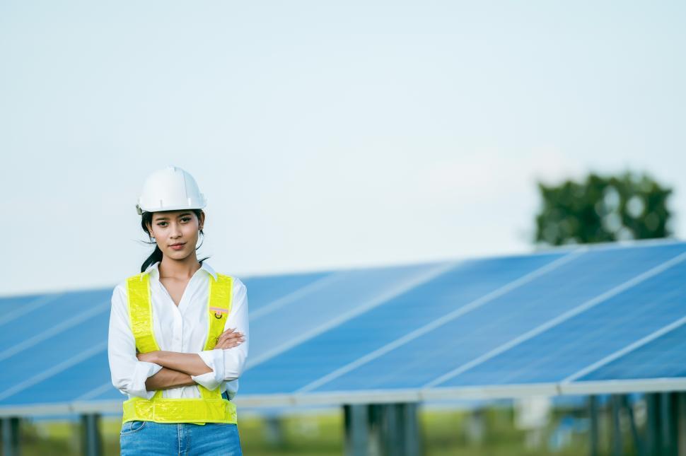 Free Image of Young engineer female checking operation in solar farm 