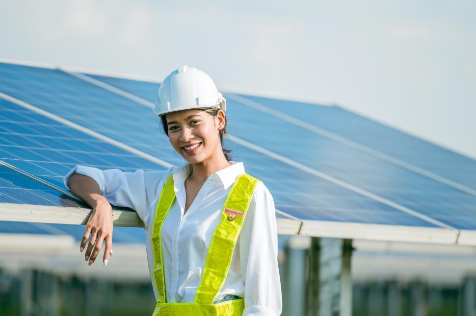 Free Image of Female engineer working with solar panels in station 