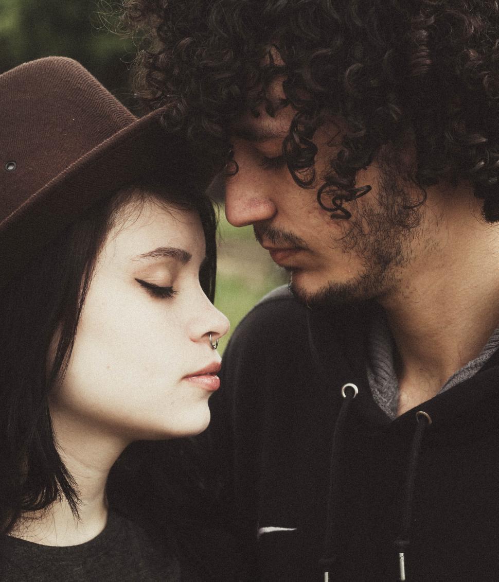 Free Image of Romantic moment shared between two people in nature 