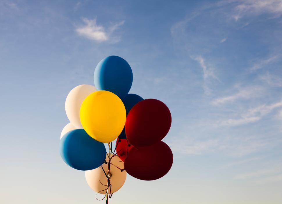Free Image of Colorful balloons in a clear sky create a joyful atmosphere at a celebration 