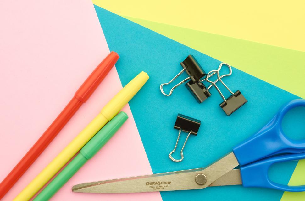 Free Image of Craft supplies on colorful paper for creativity projects 