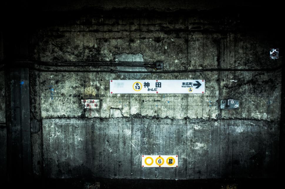 Free Image of Underground station platform with faded signs in Japan 