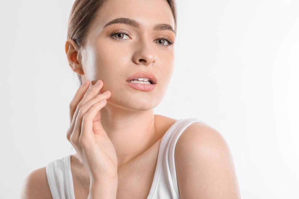 Free Image of Woman with natural beauty pose against a white background 