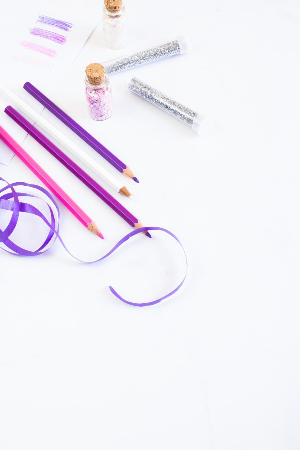 Free Image of Crafting with purple materials and decorative elements 