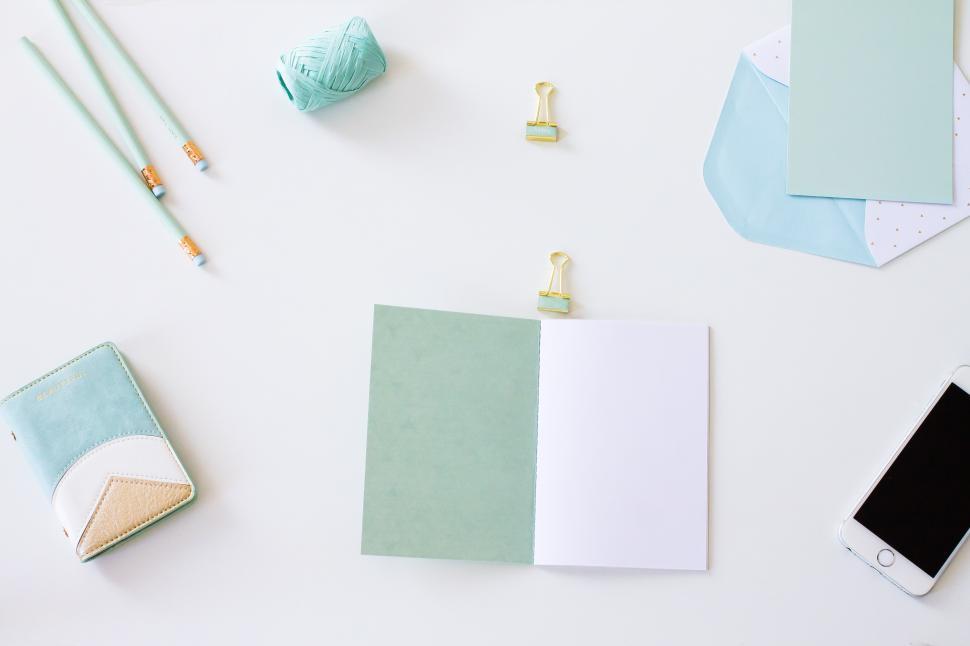 Free Image of Creative workspace with stationery and phone 