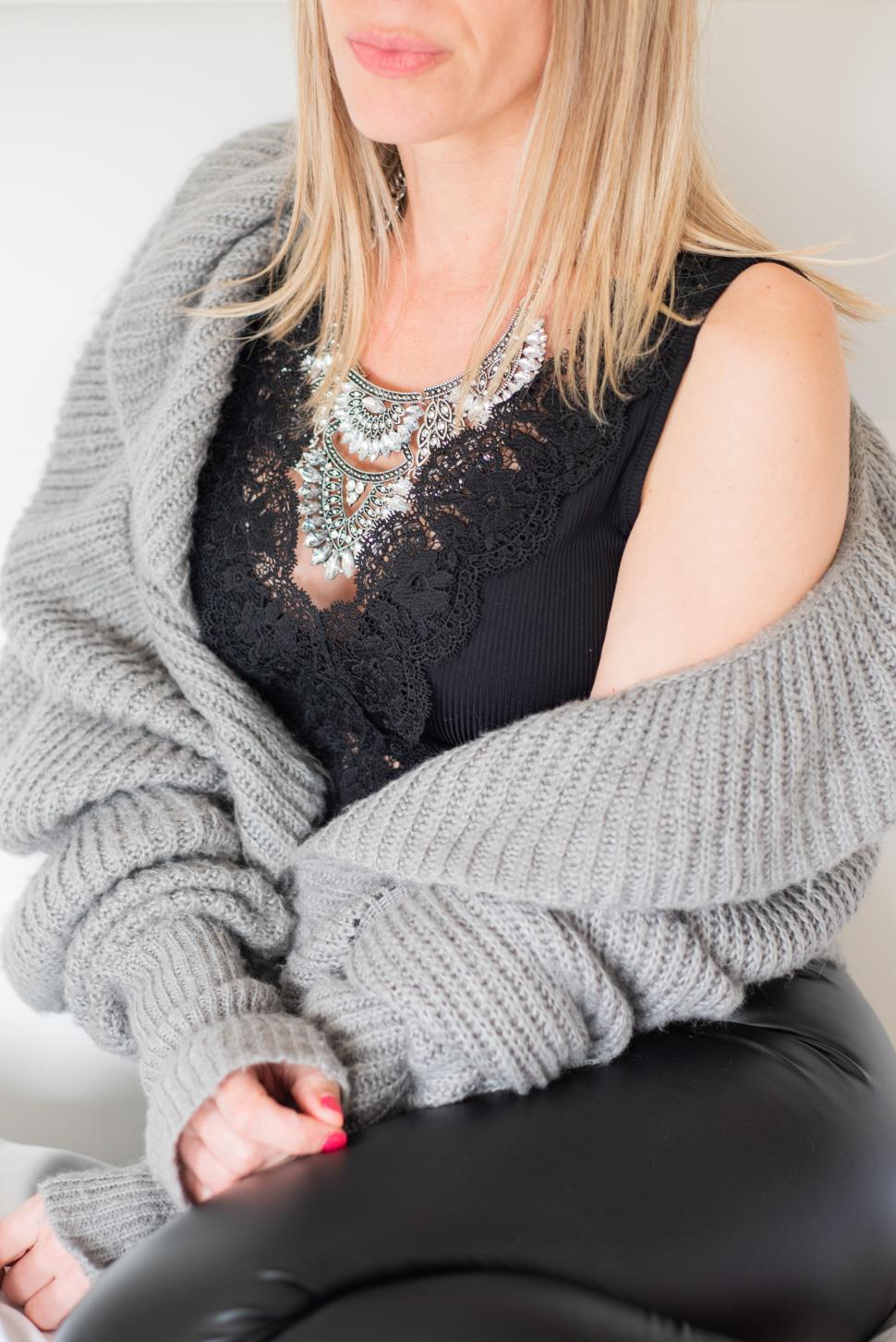 Free Image of Elegant woman showcasing fashion in cozy attire 