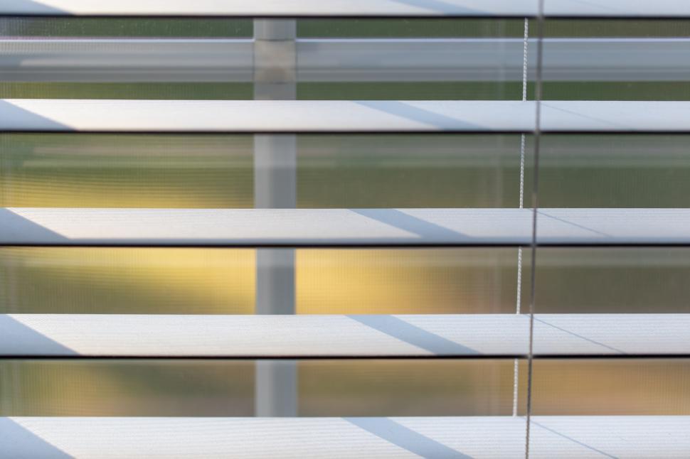 Free Image of Light filtering through white blinds in a cozy room 