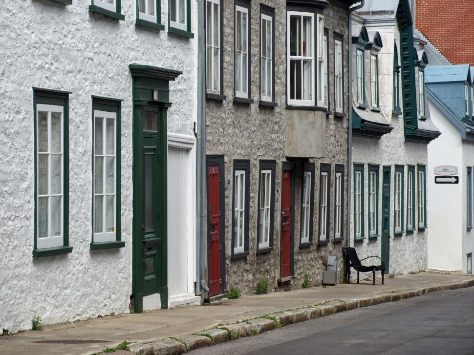 Free Image of Charming historic buildings line a quiet street in a scenic village 