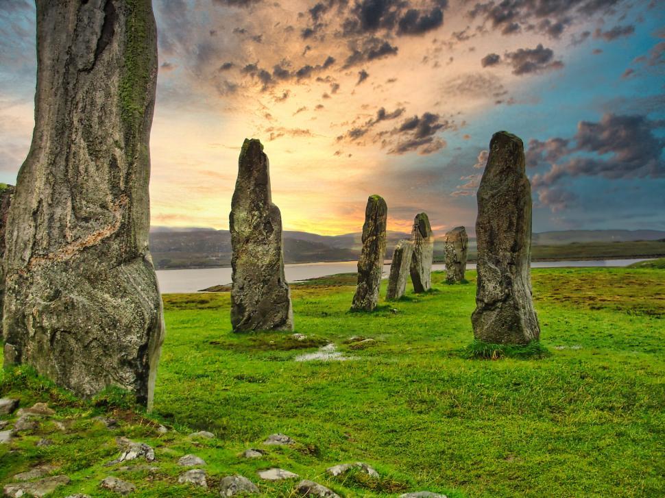 Free Image of Ancient stone circle at sunset in a coastal landscape of Scotland 