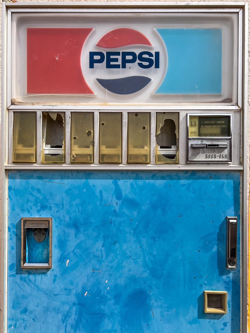 Free Image of Vintage vending machine showcasing soft drinks in an urban setting 