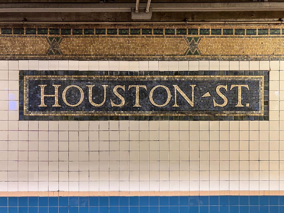 Free Image of Houston Street subway station sign with tiled mosaic design in New York City 