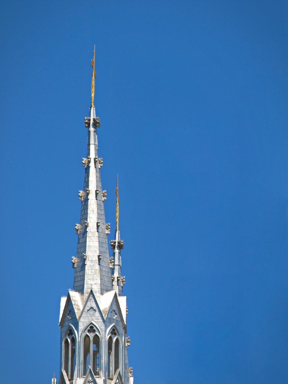 Free Image of Spires reaching for the blue sky in a historic city skyline 