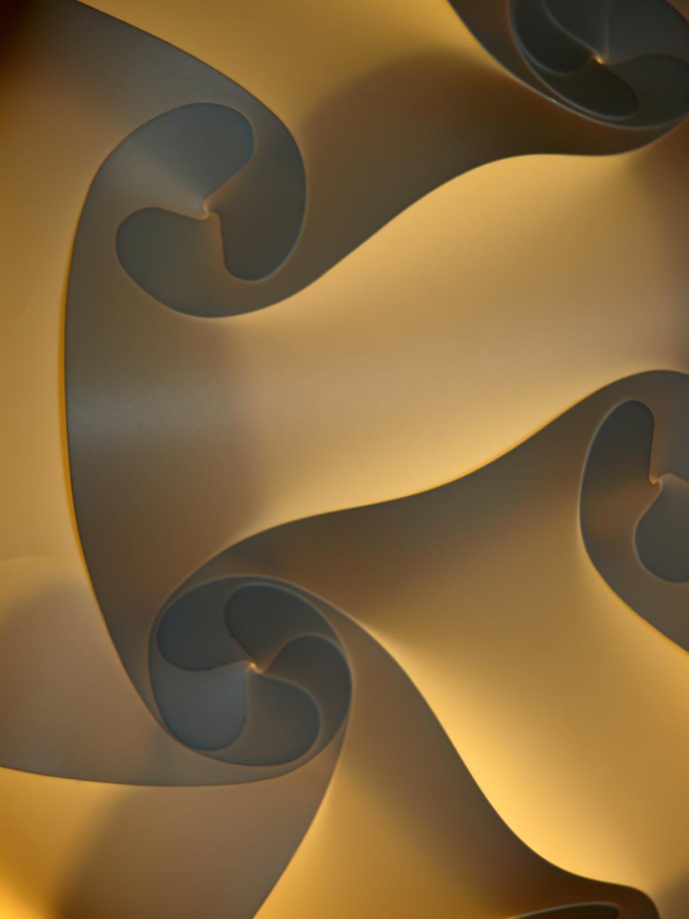Free Image of Flowing light patterns create a dynamic visual in an artistic installation 