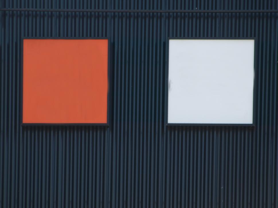 Free Image of Bold color contrast on modern building wall showcasing red and white panels 