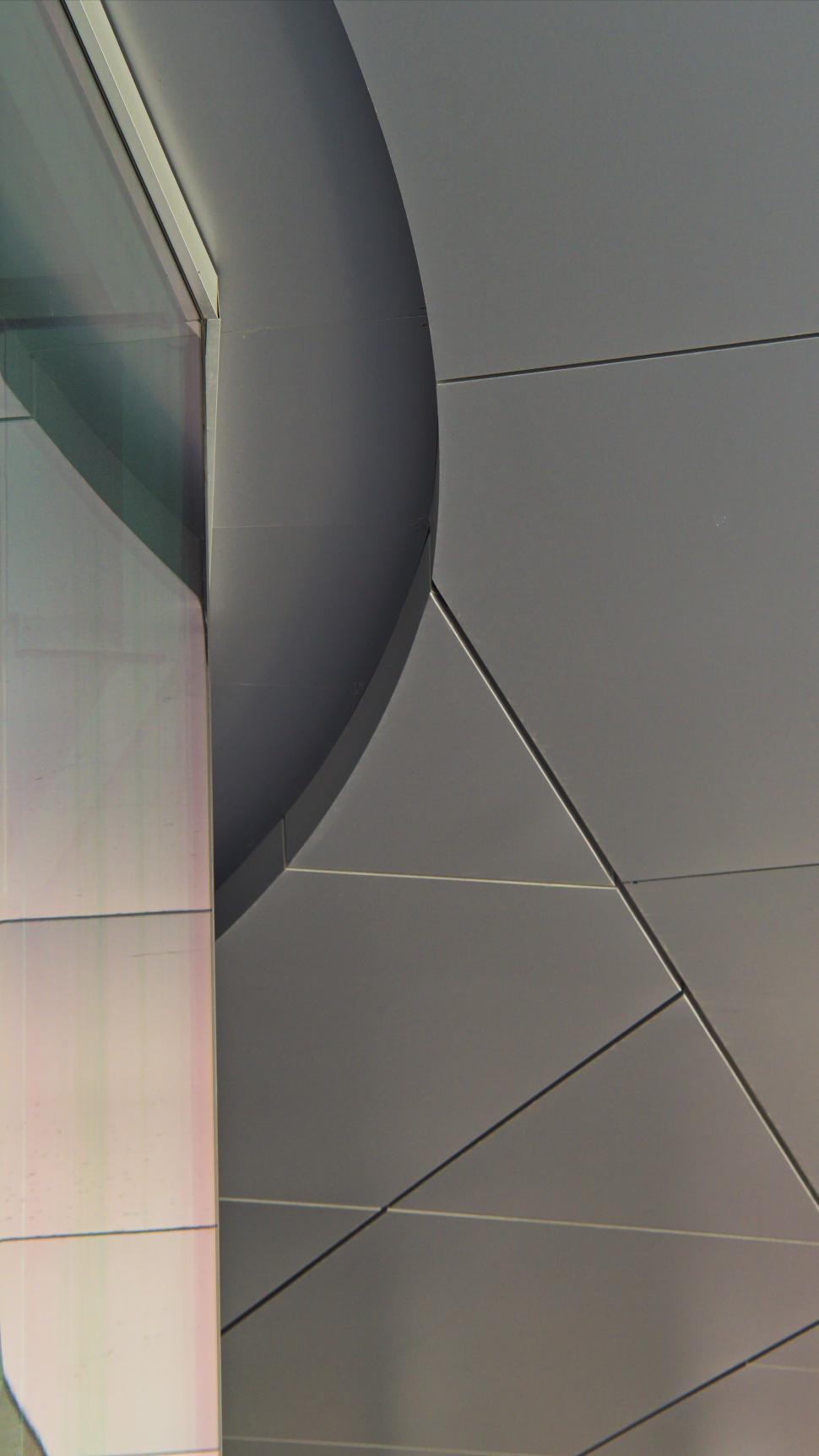 Free Image of Modern architectural design with curved lines and geometric shapes 